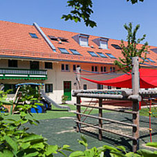 Crèche garden and playground equipment at Minihaus Bognerhof in Munich’s Trudering district